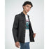 Male model wearing a white Japanese Sakura graphic men's T-shirt with cherry blossom motif under a black denim jacket.