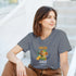 Woman wearing Fresh Juice graphic T-shirt in gray, a soft cotton blend with orange juice illustration.