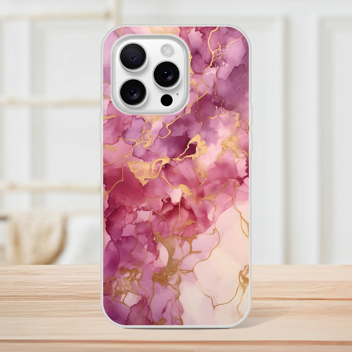 Pink marble iPhone case 13-16 in blush rose gold with gold-veined abstract design, slim matte shell.