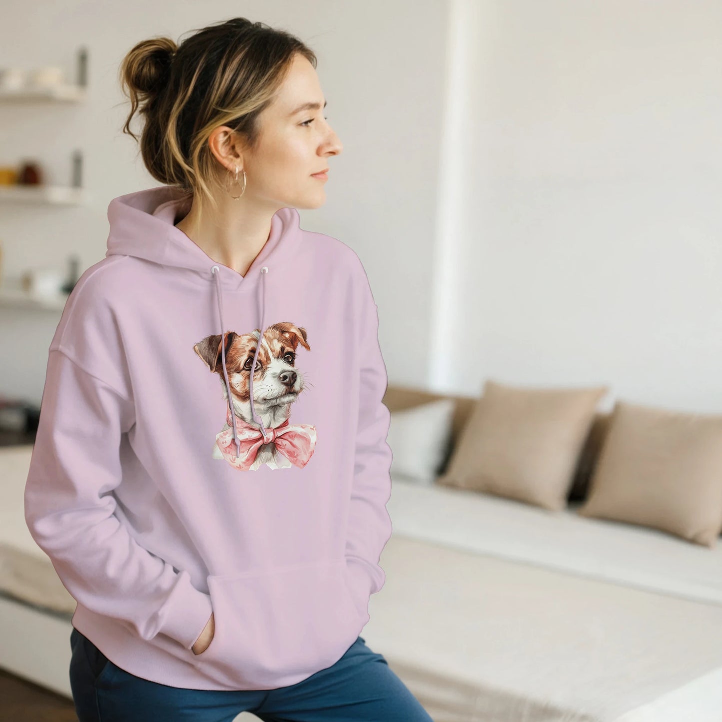 Light pink women's soft cotton-blend hoodie with a dog graphic wearing a pink bow, front pocket, drawstring hood.