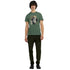 Male model wears green Gothic Gods graphic T-shirt with a bearded bust design, soft cotton blend, crew neck.