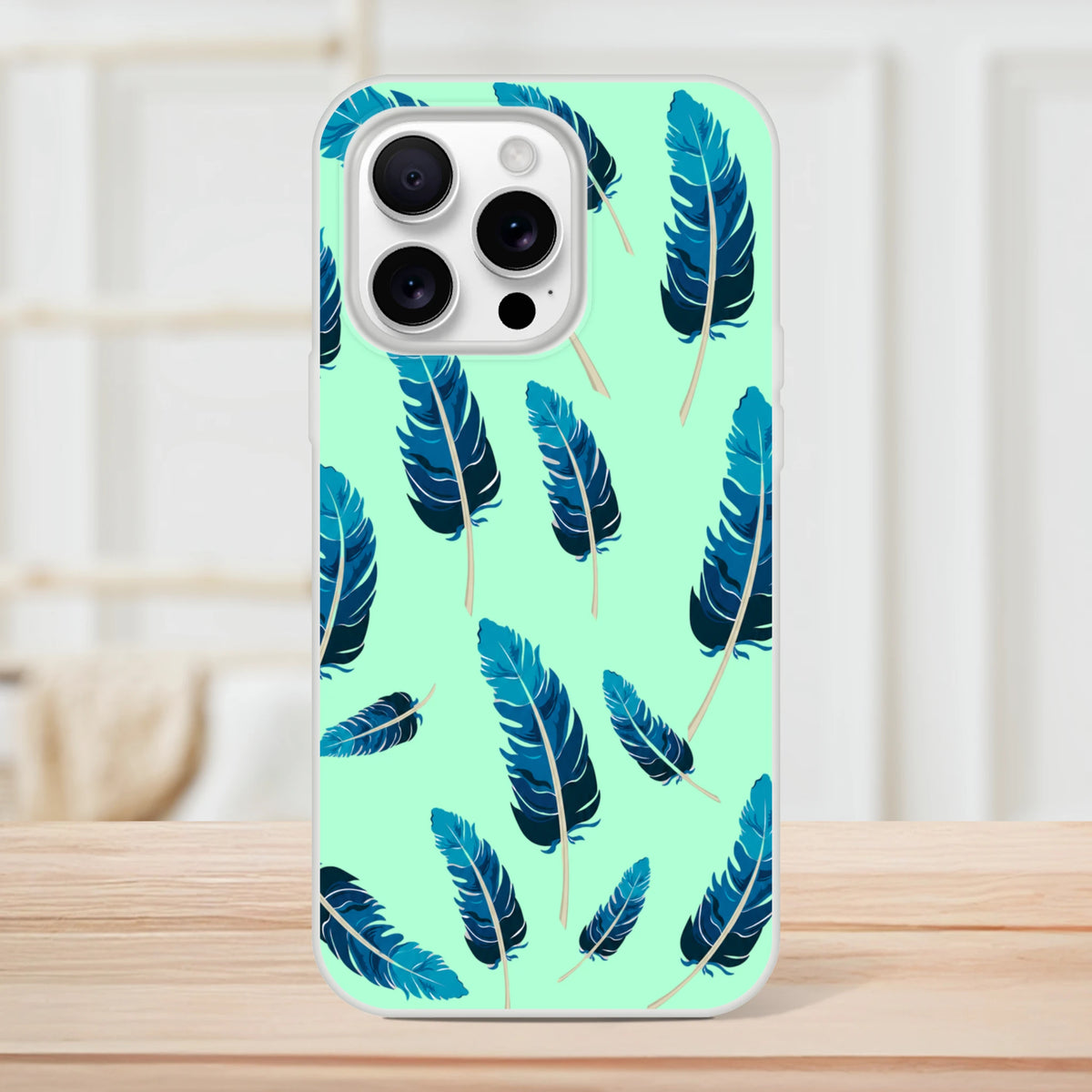 Mint-green iPhone case with blue feather motif, slim matte shell for iPhone 13-16.
