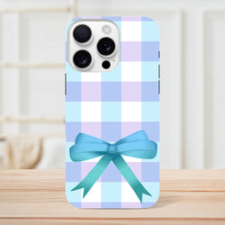 Blue gingham iPhone case with pastel checks and a 3D teal bow. Cute coquette tough phone cover for streetwear style.
