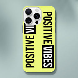 Bright yellow iPhone case featuring bold "POSITIVE VIBES" slogan text in black and white wraparound print for tough streetwear protection.