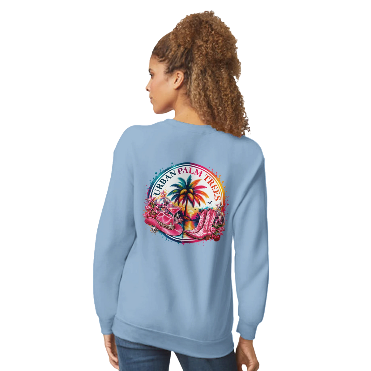 Light blue women's sweatshirt featuring a retro tropical back print with pink cowboy boots, palm trees, and disco balls.