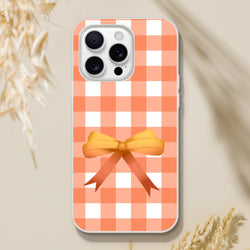 Orange gingham bow iPhone case for iPhone 13–16 in a cute coquette aesthetic.