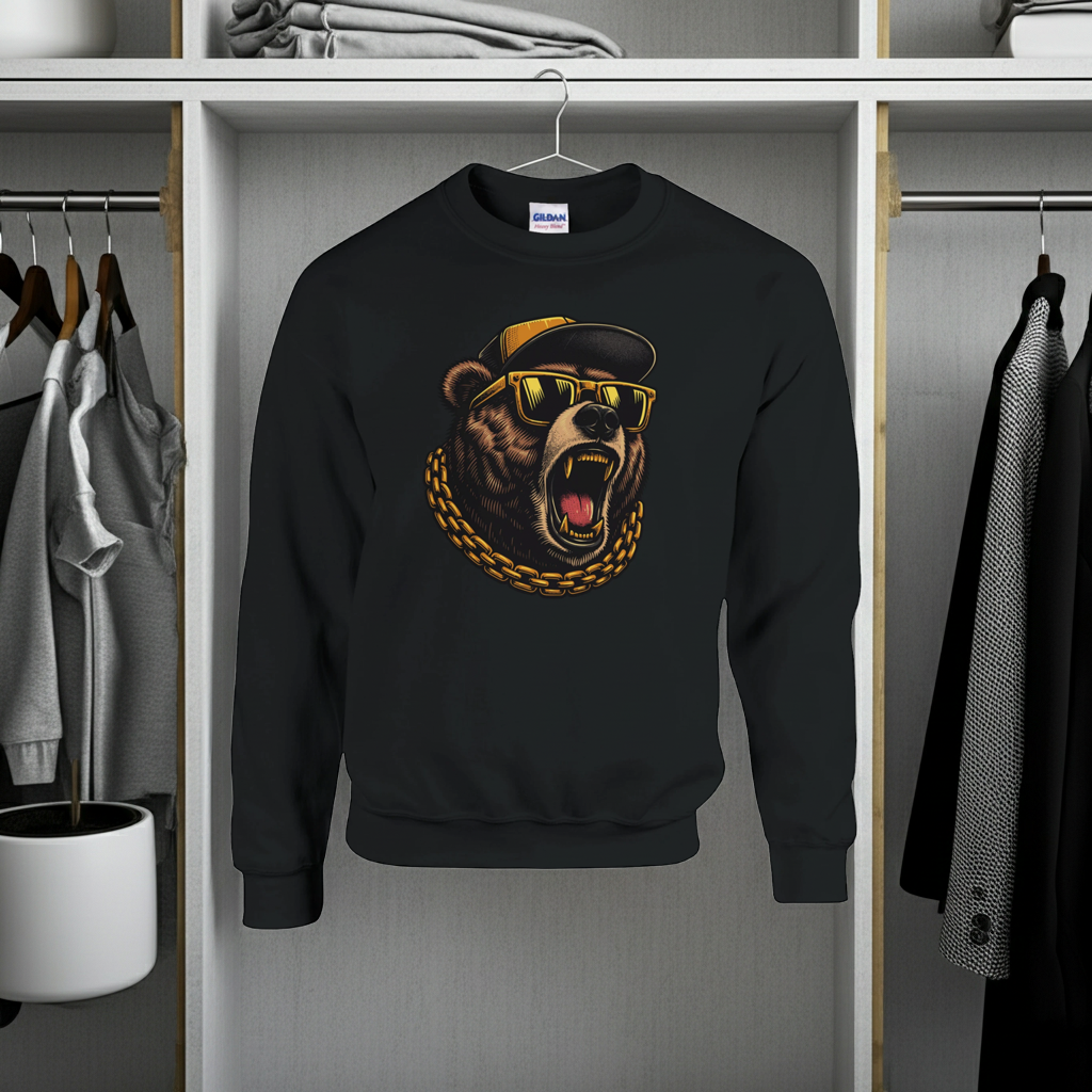 Black sweatshirt with bear graphic on a hanger in a wardrobe.