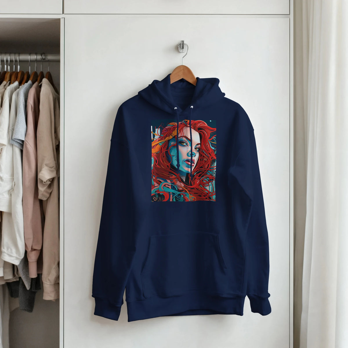 Navy blue pullover hoodie featuring bold pop art graphic of a redheaded woman with vibrant teal and red streetwear design.