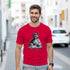 Red men's T-shirt featuring Statue of Liberty DJ graphic spinning on a turntable.