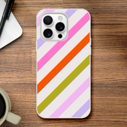 Pastel rainbow diagonal stripe iPhone case for 13-16, cute diagonal aesthetic cover on a wooden desk.