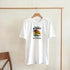 White women's cotton-blend T-shirt with tropical sunset palm trees graphic and Beach Resort text.