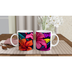 Two Colourful Tropical Hibiscus Mugs with Floral Hawaiian designs on a wooden table.