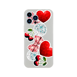 Transparent iPhone case with Y2K sticker art featuring glossy cherries, pink bows, disco balls, and red faceted hearts.