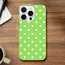 Green and white polka dot tough iPhone case with shock-absorbing TPU core for drop protection, featuring glossy opaque finish and precise cutouts.