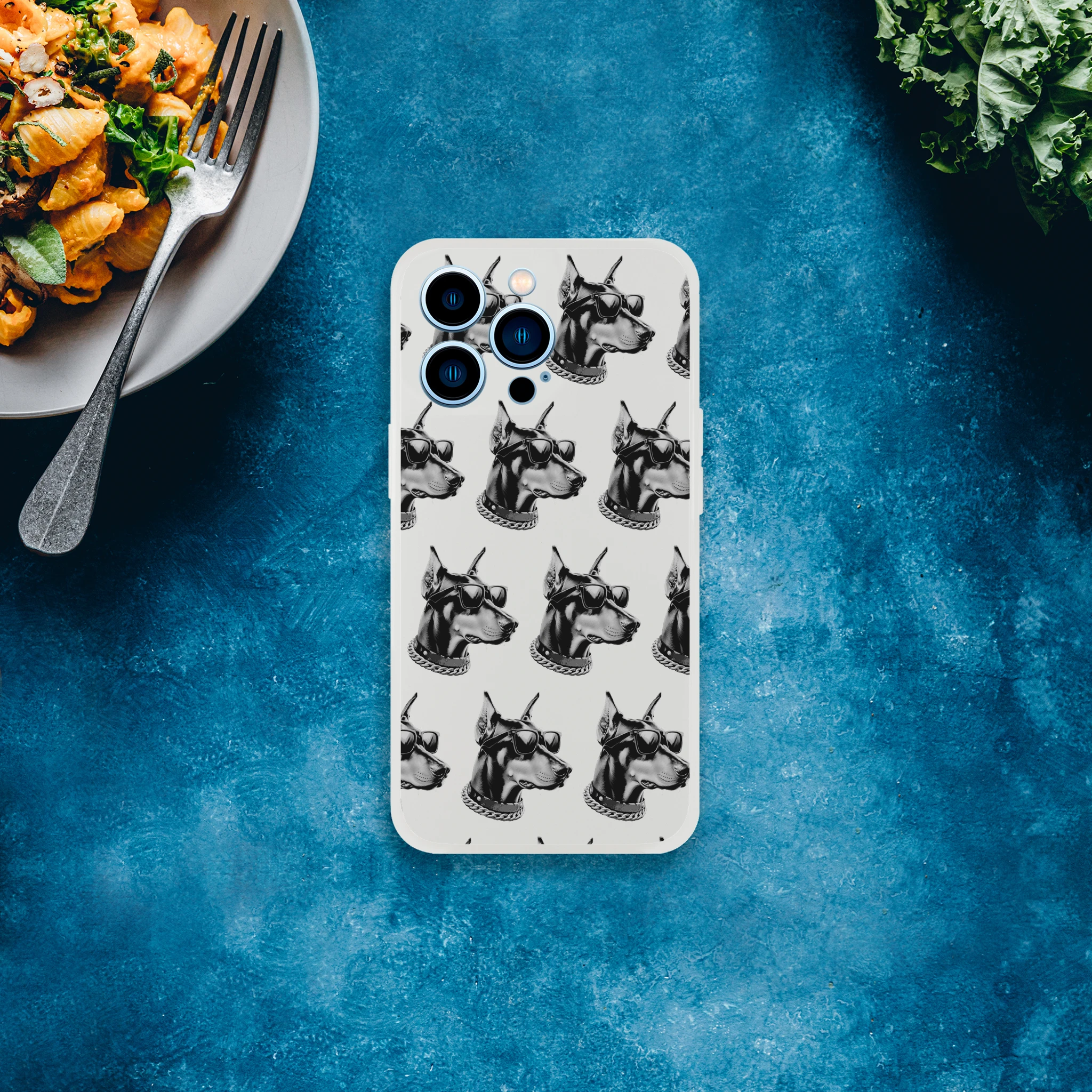 Transparent iPhone case for 13-16 with a repeating gangster Doberman pattern wearing sunglasses.
