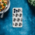 Transparent iPhone case for 13-16 with a repeating gangster Doberman pattern wearing sunglasses.
