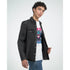 Male model in white Monkey DJ graphic T-shirt with crew neck under a black denim jacket.