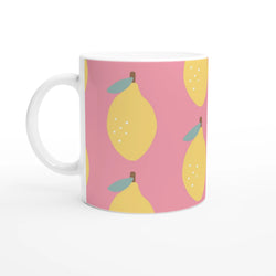 Cute lemon-pattern ceramic mug in pink with a white handle.