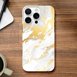 Luxury white and gold marble iPhone case with abstract flowing patterns resting on a wooden desk.
