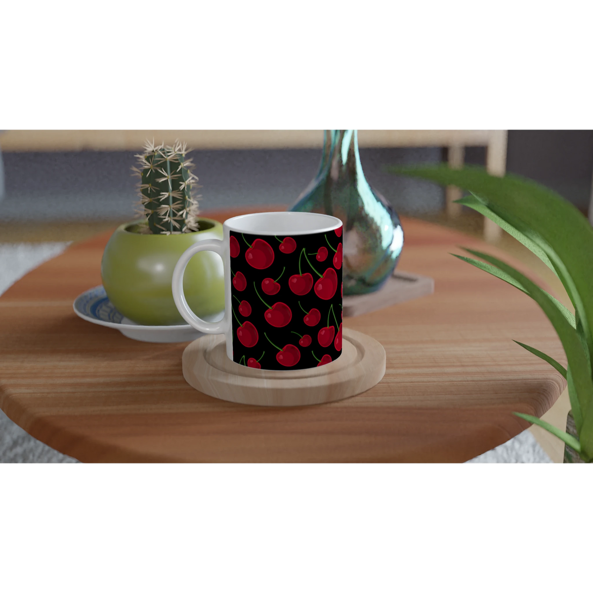 Red Cherry Ceramic Mug with Black Retro Fruit Pattern on a wooden table beside a cactus, white interior.