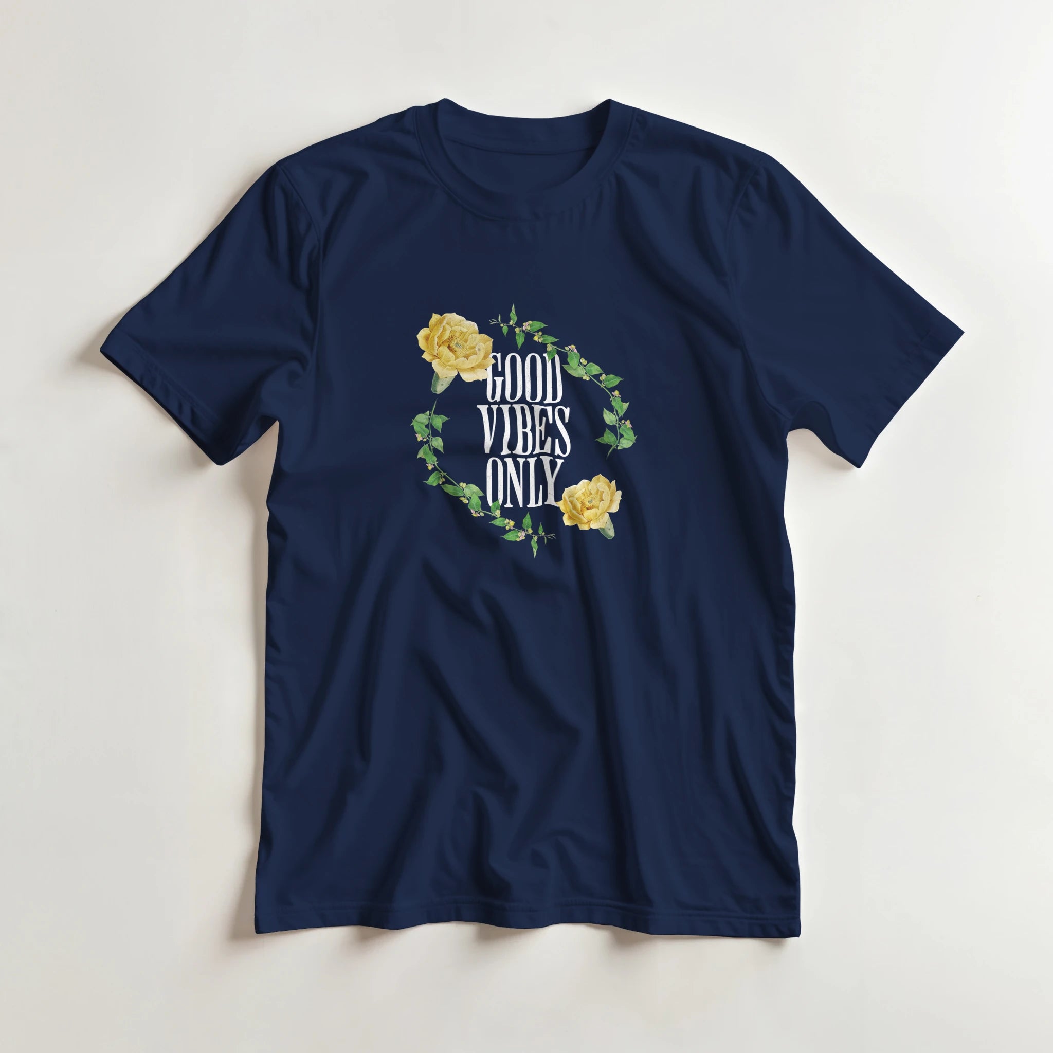 Navy blue men's graphic tee featuring GOOD VIBES ONLY inside a leafy vine circle with yellow roses.