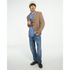 Male model in blue Stressed Teddy Bear graphic sweatshirt with tan blazer, denim jeans, beanie, and loafers.