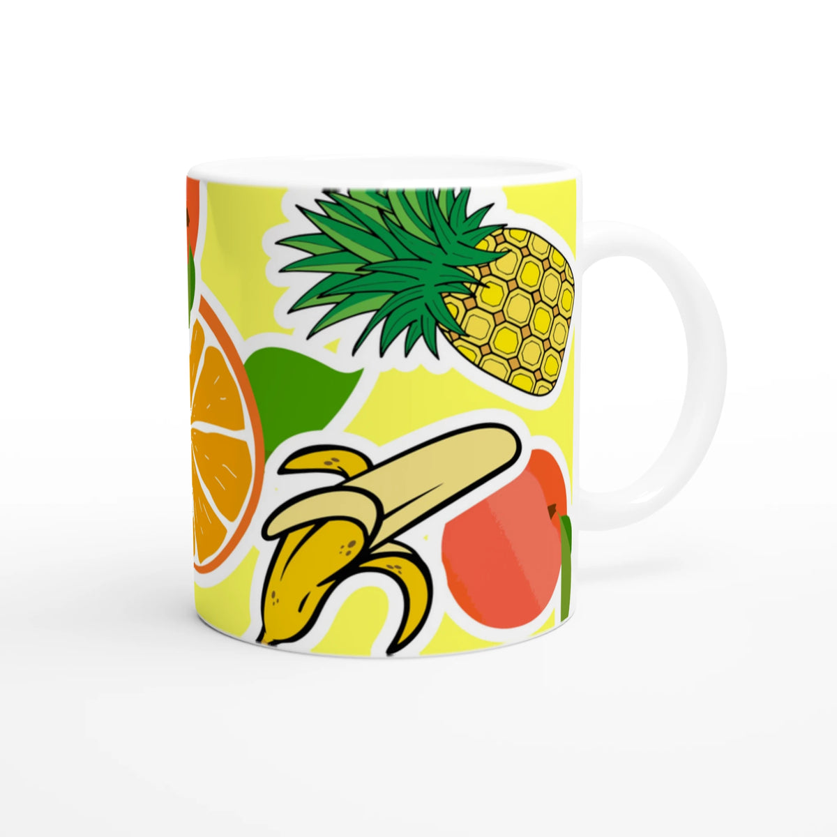Ceramic coffee cup featuring vibrant sticker-style illustrations of a banana, pineapple, and orange against a yellow background.