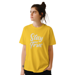 Woman in yellow Stay True T-shirt with retro slogan, urban palm trees vibe.