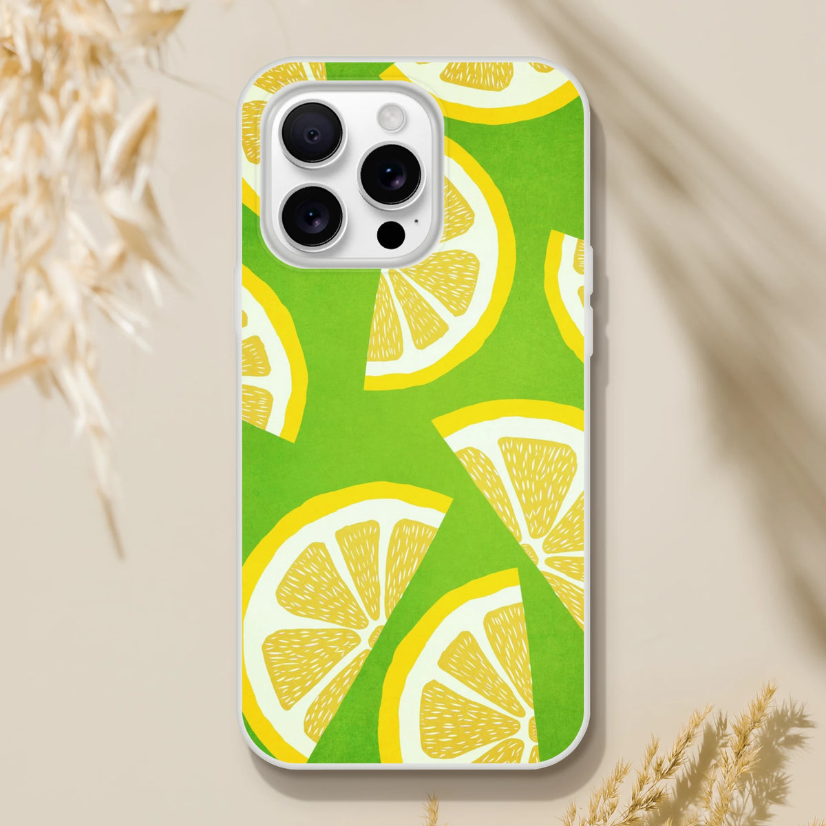 Slim matte lemon-slice iPhone case for iPhone 13–16 with a vibrant green citrus print.