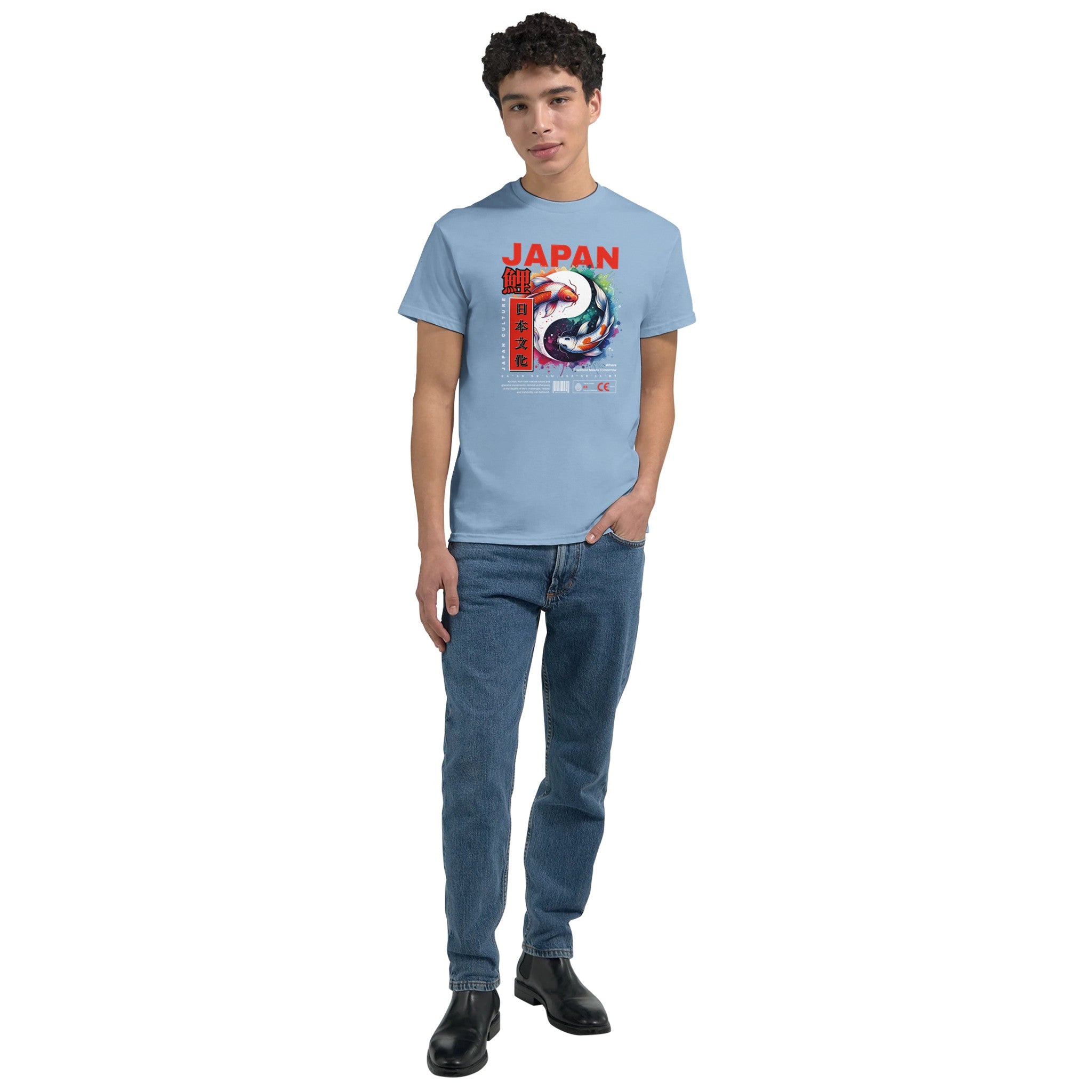 Young man wearing a light blue soft cotton-blend Japanese graphic T-shirt with red JAPAN text and koi illustration.