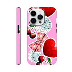 Pink iPhone case with cherry bow sticker art, disco balls, and red hearts. Y2K style tough cover for city commutes and durable protection.