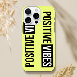Bright yellow iPhone case featuring bold "POSITIVE VIBES" slogan in black and white block lettering with streetwear aesthetic.