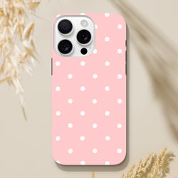 Pastel pink and white polka dot tough iPhone case offering shock-absorbing protection with a cute dual-layer frame design.