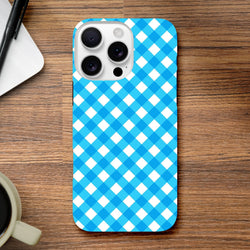Retro blue gingham checkered tough iPhone case featuring shock-absorbing protection and wireless charging compatibility on a wooden desk.