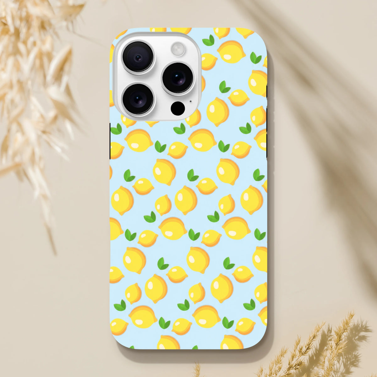 Cute lemon pattern iPhone case with fresh yellow fruit and green leaves on a light blue background for models 13-16.
