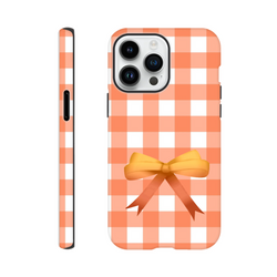 Orange gingham iPhone case with a cute yellow coquette bow. Tough checkered phone cover for impact resistance.