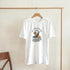 White women's Happy Hour graphic tee with tropical cocktail and citrus slices, reading Cocktails & Drinks.