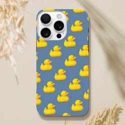 Blue iPhone case featuring a playful pattern of yellow kawaii rubber ducks for a cute and tough streetwear look.