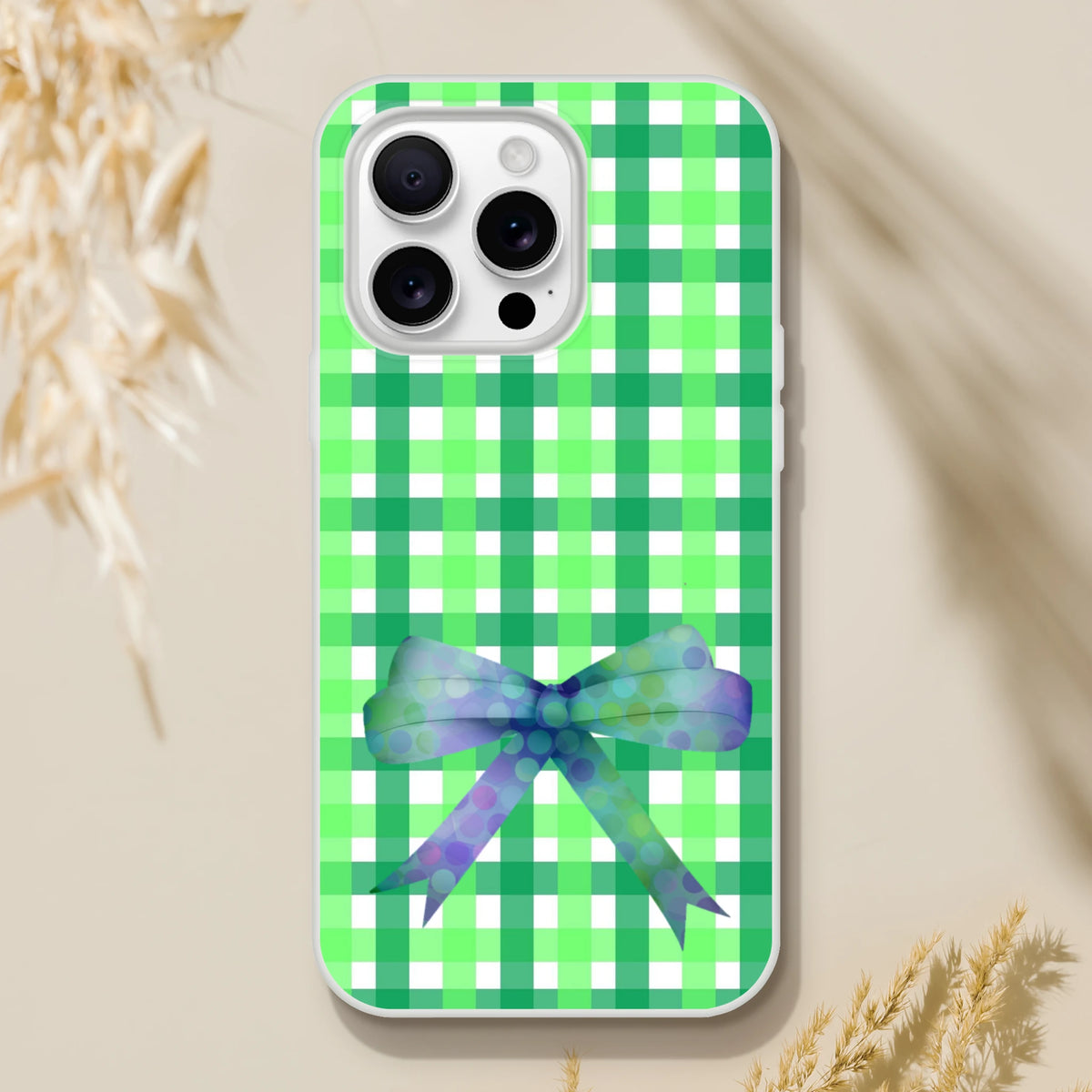 Green gingham bow iPhone case for iPhone 13-16 with frosty transparent TPU shell and long-lasting bow.