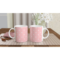 Retro pastel pink ceramic mug with white polka dots and comfy handle. Cute coffee cup for daily tea or coffee routines.