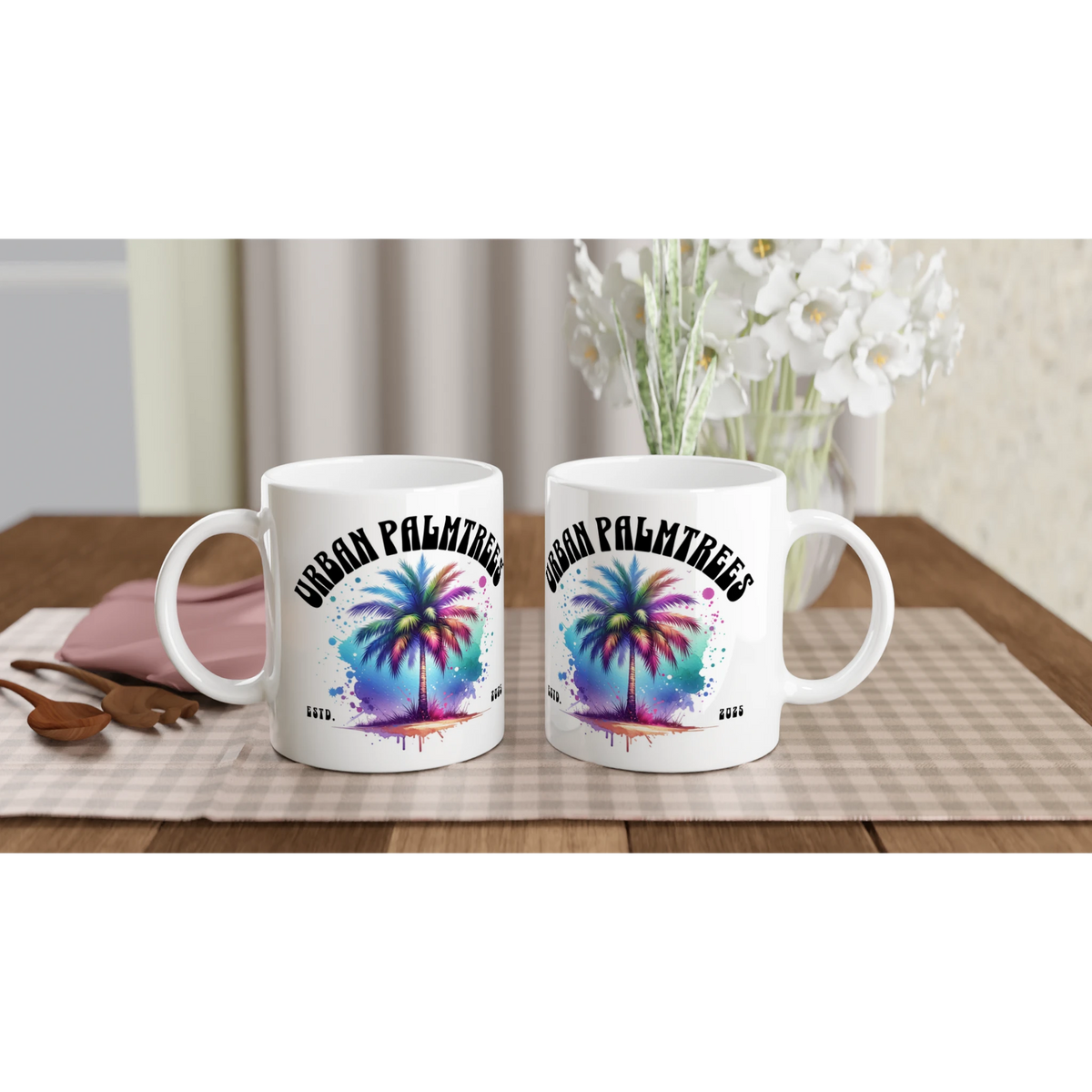 Two white mugs with a colorful retro palm trees design and Urban Palm Trees logo.