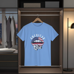 Blue t-shirt with 'American Girl' design hanging in a wardrobe.