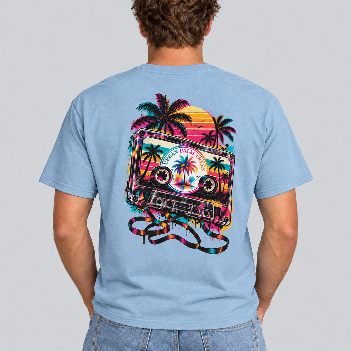 Men's light blue T-shirt with back cassette graphic and colorful palm trees art