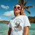Happy Hour Women's Graphic T-Shirt in white cotton blend with tropical cocktail print; beachside vibe.