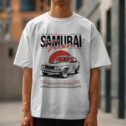 White cotton-blend Japanese JDM men's graphic T-shirt with a vintage rally car illustration and bold typography.