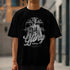 Black Gothic Glory men's graphic T-shirt featuring a sculpted statue, ornate halo, and bold 'Glory' script.