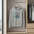 Gray hoodie with a panda design hanging in a wardrobe.