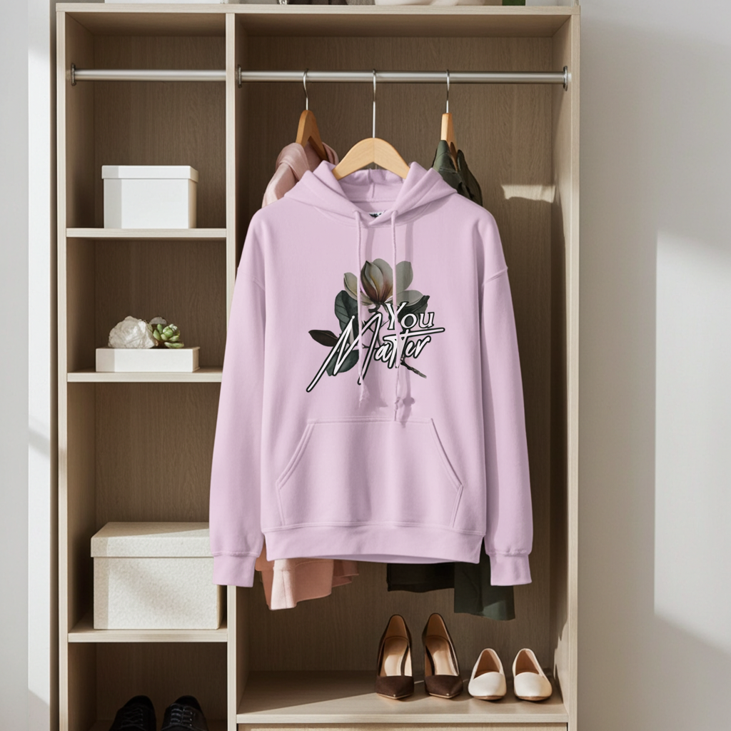 Light purple hoodie with floral design on a wooden shelf with shoes and boxes.