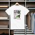White t-shirt with 'Purple Drop' graphic design on a hanger in a wardrobe.