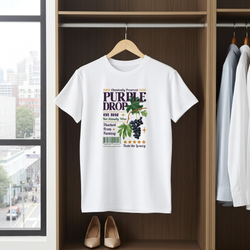 White t-shirt with graphic design hanging in a wardrobe.